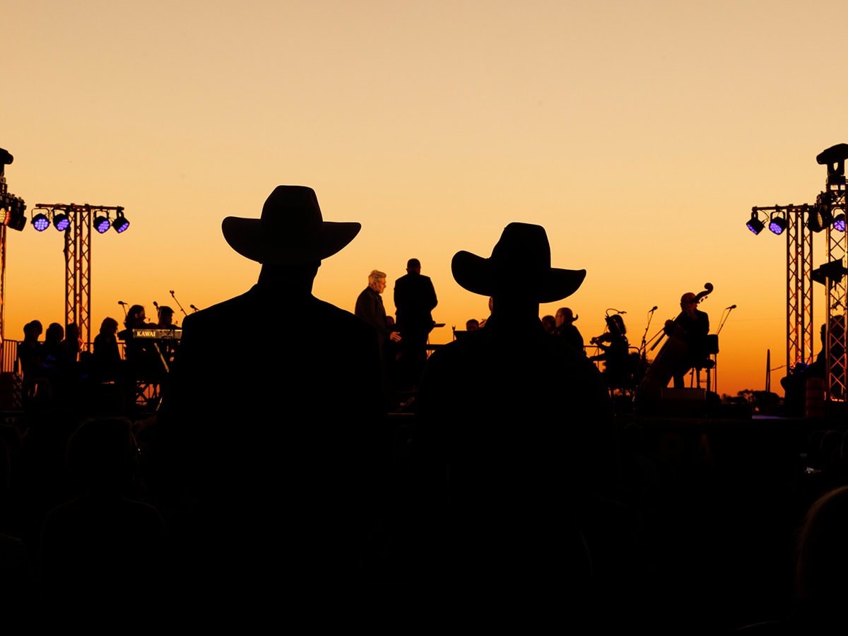 silouettes of crowd and performers at Festival of Outback Opera Singing In The Night event 2024