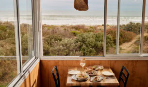 a dining setup at Kuti Shack overlooking Goolwa Beach