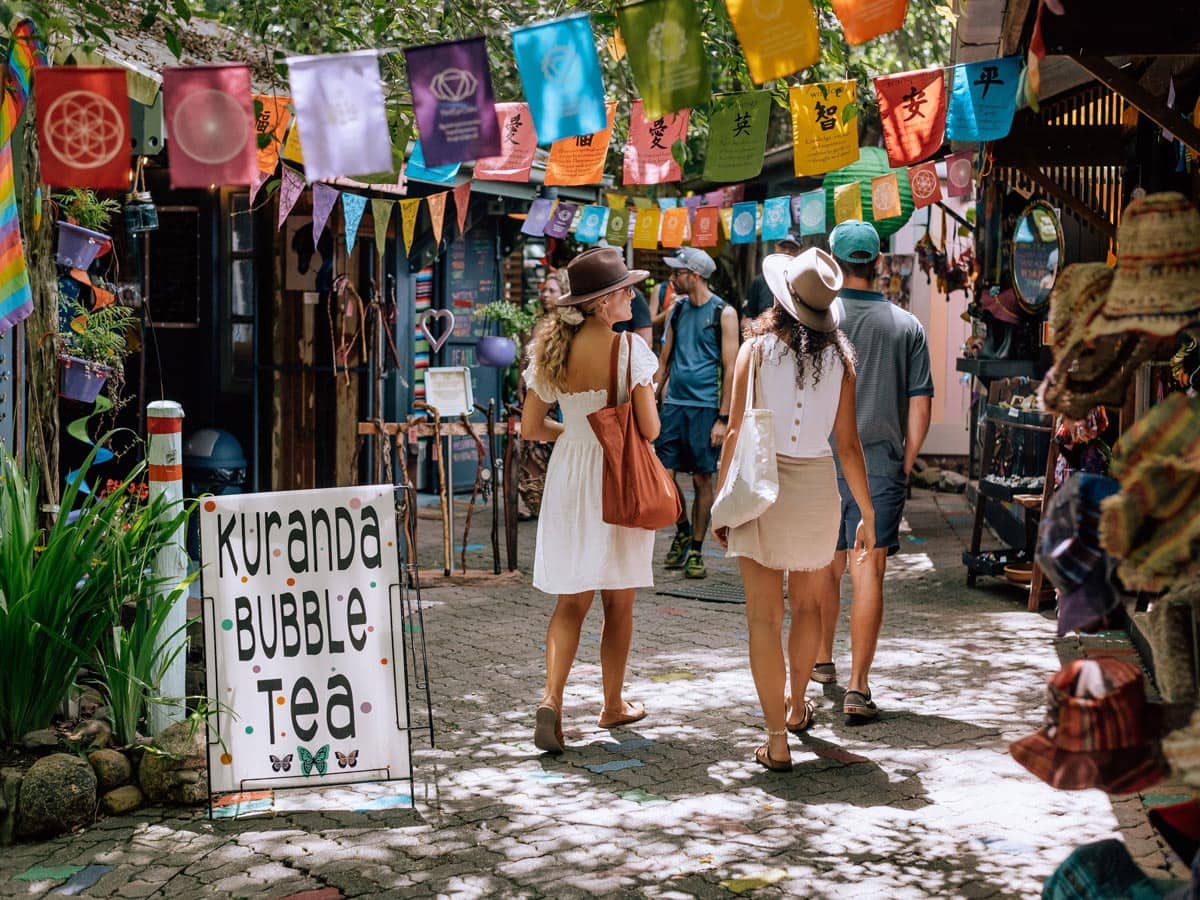 friends walking through the Original Rainforest Markets in Kuranda