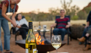 Family around the campfire at Squeaky Windmill near Alice Springs