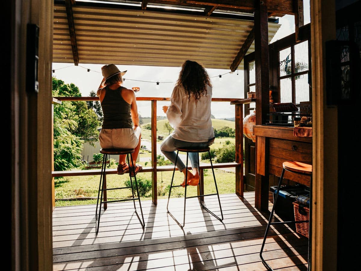 Couple on the deck at Hazy Stays in Byron Bay