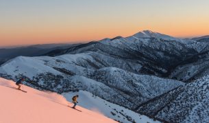 Skiers heading down slopes at Mount Hotham in Victoria