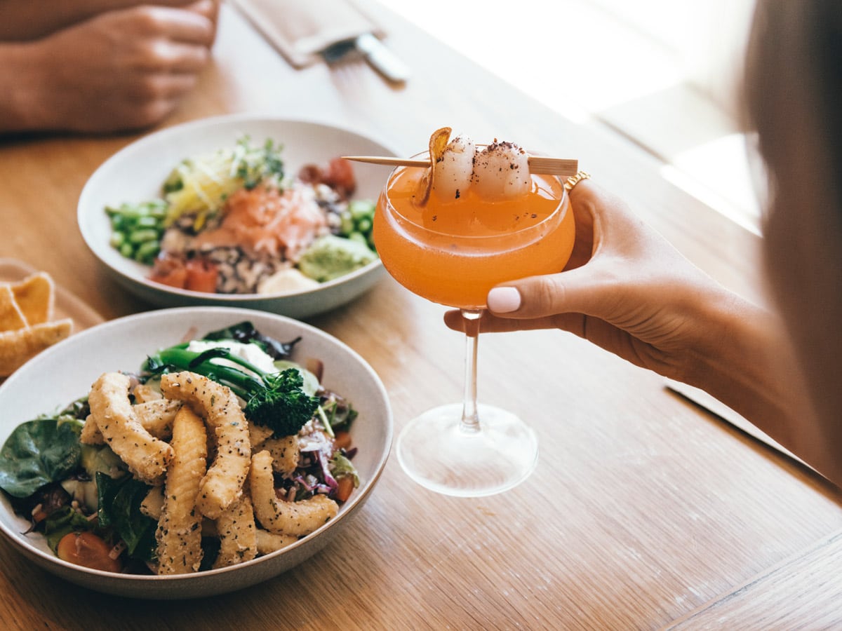 Couple enjoying a feast at Moku Bar & Grill in Cairns