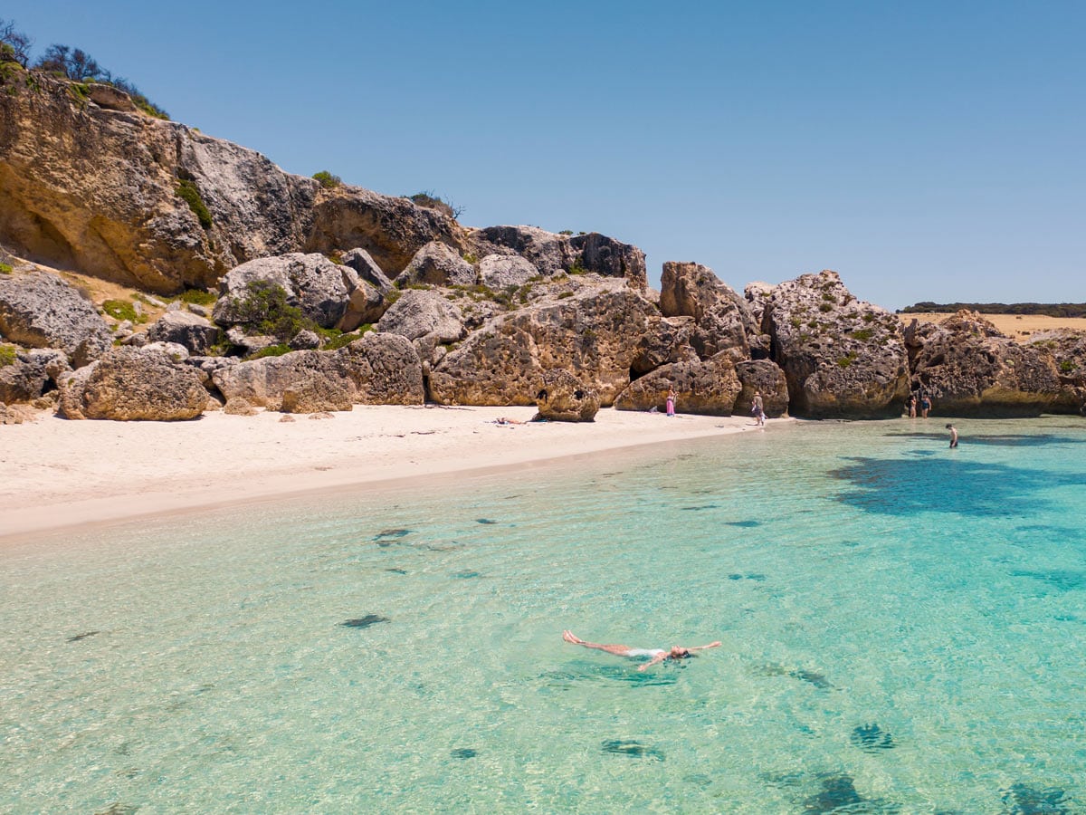 the white-sand shoreline and crystal clear waters of Stokes Bay