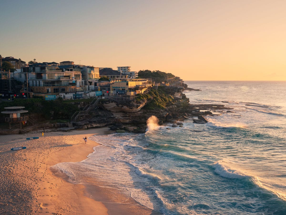 Surfer at Tamarama Beach at sunrise