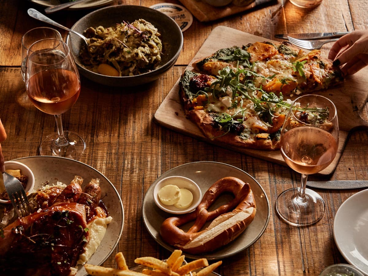 table spread of beer and food at The Haus Restaurant in Handorf South Australia