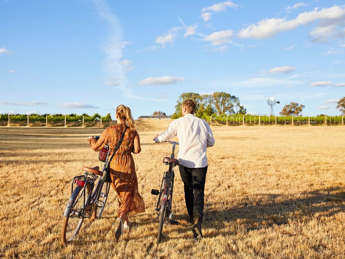 Couple cycling Mudgee vineyards with Tour De Vines